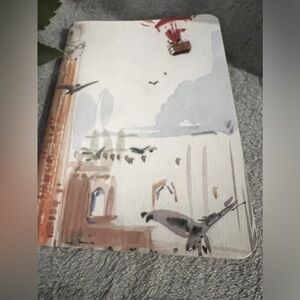 Louis Vuitton small notebook.